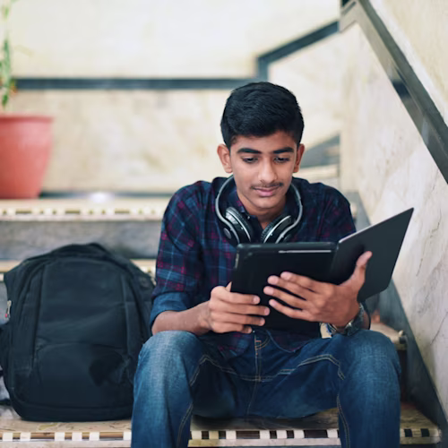 A teacher in a classroom who uses Docusign for student forms