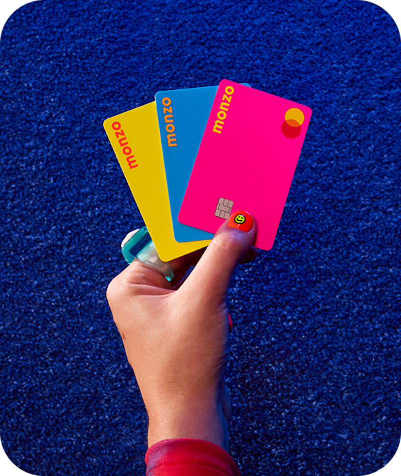 Monzo Under 16s fan of neon cards in child's hand